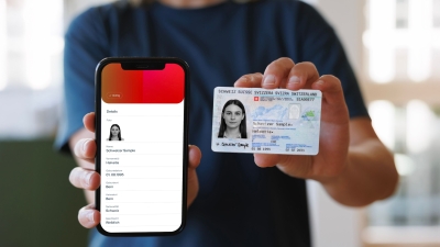 A person presents a digital and physical ID card.