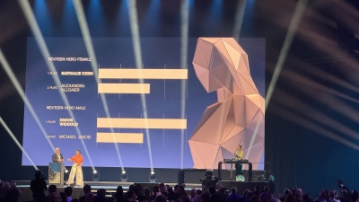  The photo shows the two winners of the NextGen Hero 2025 category. Nathalie Kern and Simon Weigold on stage.