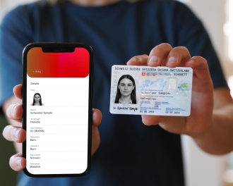A person presents a digital and physical ID card.