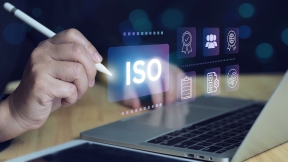 Stock photo showing the review of ISO certification standards with digital icons representing quality control