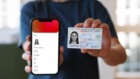 A person presents a digital and physical ID card.